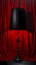 black table lamp,painted lamp, on a red velvet background, generated by AI, generative assistant.