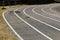 Black tarmac asphalt of running track, athletic sport background