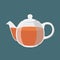 Black tea, hot drink. Transparent teapot with golden brown tea