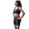 Black teen fitness girl looking aside isolated.