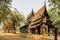 Black Temple in Chiang Rai,Thailand.Popular tourist place.Wooden house gold facade.Carved painted wood.Thai style house decor.Thai