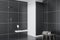 Black tile bathroom corner, shower