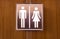Black toilet sign , Cute man and lady on Wood background