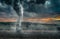 Black tornado funnel over field during thunderstorm