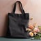 Black tote bag mockup with flowers.