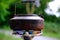 Black tourist kettle boils water on a gas burner, camping food cooking concept, romantic breakfast on vacation, travel, trip on