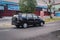 Black Toyota kijang Innova on the road afternoon