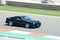 Black Toyota Supra A70 racing on the race track