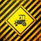 Black Tractor icon isolated on yellow background. Warning sign. Vector