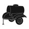 Black trailer on wheels with yellow barrel. Agricultural machinery for watering plants.Agricultural Machinery single