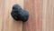 Black truffle on wood cutting board