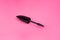 Black tube mascara for lashes make up on pink background