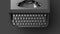 Black typewriter on a black background