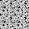 Black uneven specks, spots, blobs seamless pattern