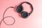 Black unplugged Studio headphone on pink