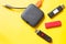 Black USB HUB with usb stick flash drives on yellow background. Top view