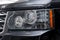 Black used Land Rover Range Rover Supercharger 2010 with front headlight view on the car snow parking after preparing for sale