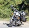 Black vintage custom motorcycle standing on the road in a sea locality.