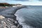 The black volcanic beach of La Caletta. Surf of The Atlantic Ocean and rocky coast of island. Tenerife, Canary Islands, Spain