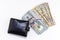 Black wallet, hundred dollar bills on white background with copy space. finance and money background. American Dollars Cash Money