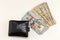 Black wallet, hundred dollar bills on white background with copy space. finance and money background. American Dollars Cash Money