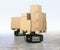 Black warehouse robot carriers carrying cardboard boxes