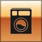 Black Washer icon isolated on gold background. Washing machine icon. Clothes washer - laundry machine. Home appliance symbol.