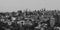 Black and white aerial view of New York skyline and attractions.