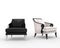 Black and white armchairs with various armrests