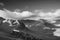 Black and white Autumn landscape image looking from Pike O`Blisco towards Langdale Pikes and Range with beautiful sungiht on