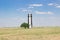 Black and white beacon stands on clear field