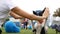 Black and white border collie running on the green grass performs tricks