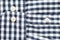 Black and white check shirt sleeve and button