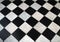 Black and white checkered marble floor pattern