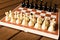 Black and white chess on a chessboard on a wooden table. Chess g