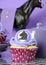 Black and white chevron with purple theme party cupcake closeup.