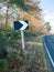 Black and white chevron road sign turn way no cars country