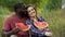 Black and white couple enjoying themselves and eating delicious watermelon