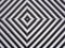 A black and white diamond pattern formed in woven plastic as a background