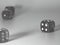 Black and white dice rolled randomly