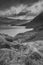 Black and white Epic early Autumn Fall landscape of view along Ogwen Valley in Snowdonia National Park under dramatic evening sky