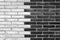 Black and White exposed brick wall background texture without plaster