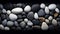 black,white and grey stones on the black background