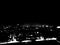 A black and white, high contrast image of the urban skyline shot during night time in Bangalore