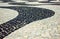 Black and white iconic mosaic by old design pattern at Copacabana Beach, Rio de Janeiro, Brazil