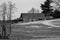 A Black and White Image Barn on a Mountain Farm