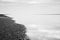 Black and white image of beach at low tide landscape