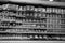 Black and White Image of Different types of cheese on shelves in a grocery store. Shelf of packaged products, butter and cheese at