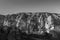 Black and white image of Nunnery inside volcanic rock landscape