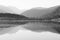 Black and white image of Rocky Mountains reflecting on Lake Granby, Colorado